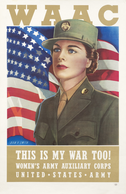 Woman soldier stands in front of US flag - green, red, blue