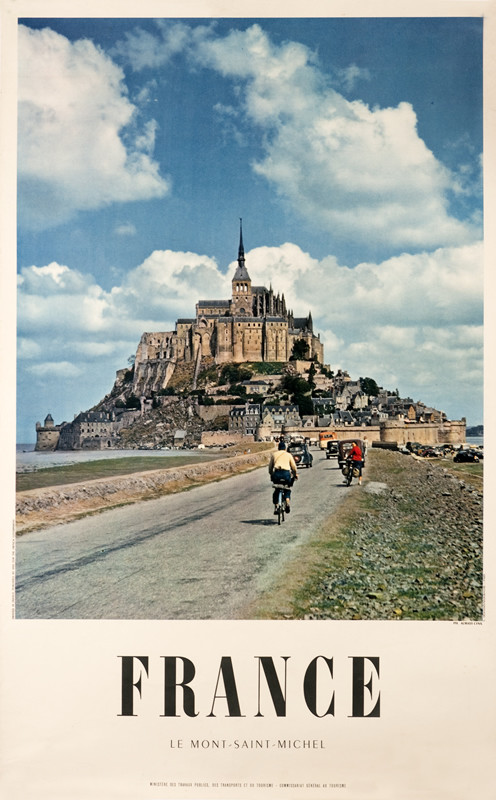 Photo of causeway and Mont St. Michel; blue, brown