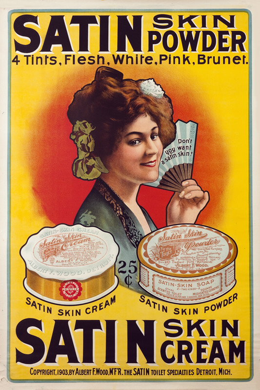 Woman with hair pinned up, holding fan, wearing robe, tins of skin cream and powder; yellow, red, green
