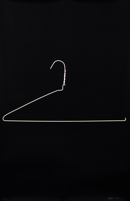 A wire hanger forms the number 2; black, white, pink, yellow, green