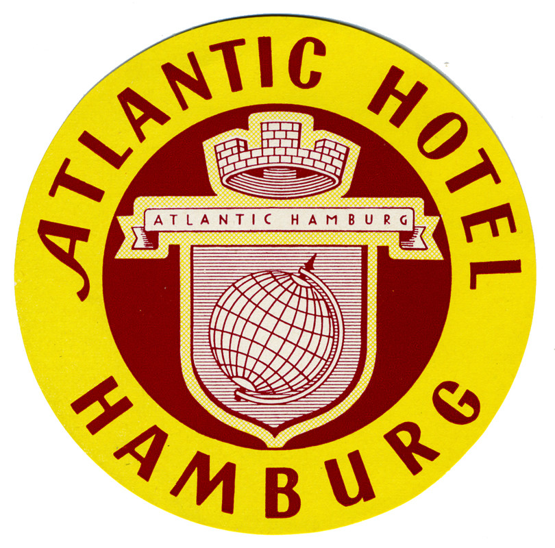 Crest with globe and topped with crown; red, yellow, white