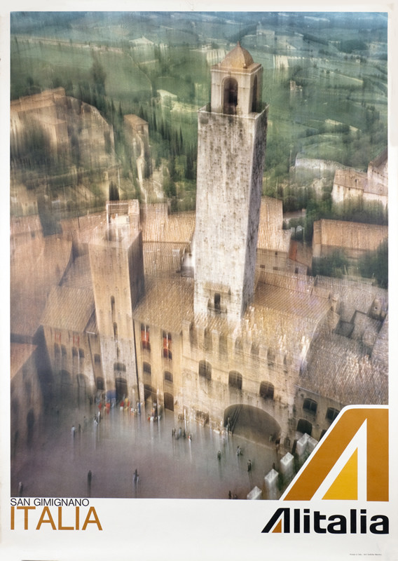 Blurry photo view of  San Gimignano; white, brown, blue