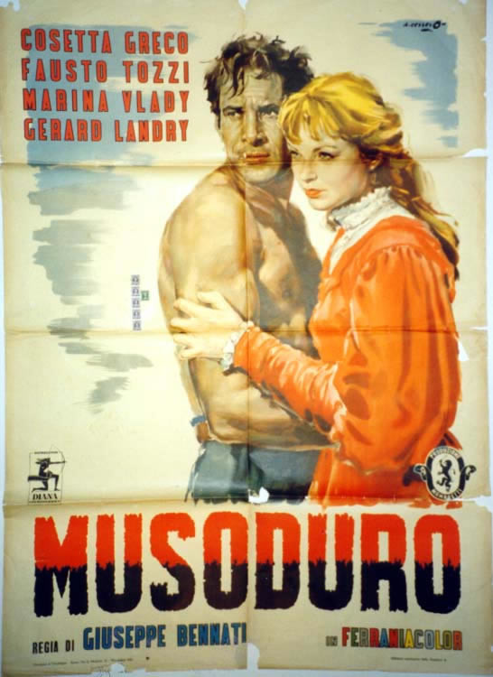 Bare-chested man and blonde woman embrace, looking left