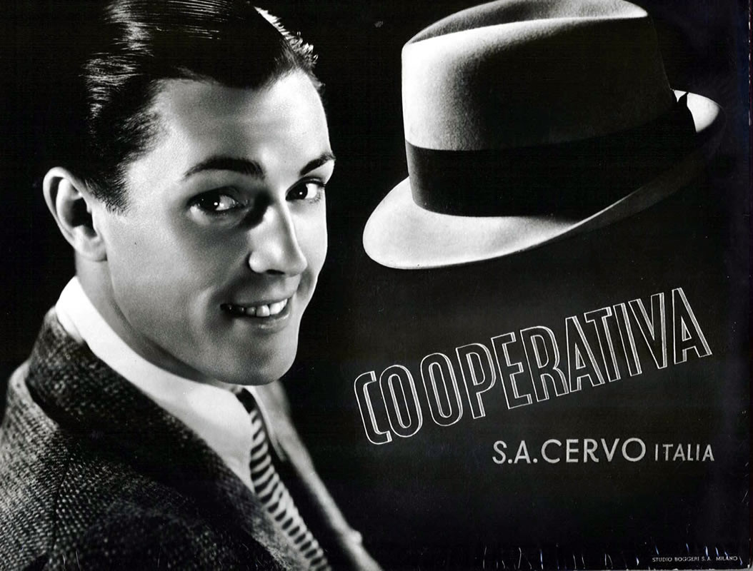 Man in coat and tie, hat; black and white