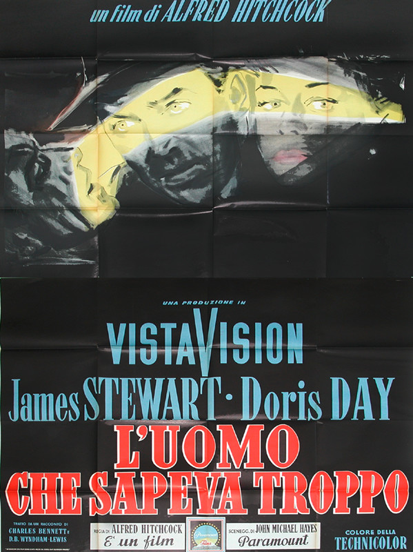Jimmy Stewart and Doris Day in flashlight lighting of Hitchcock film; black, yellow