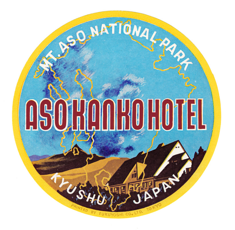 View of the Aso Kanko Hotel with Mt. Aso in the background; blue, red, brown