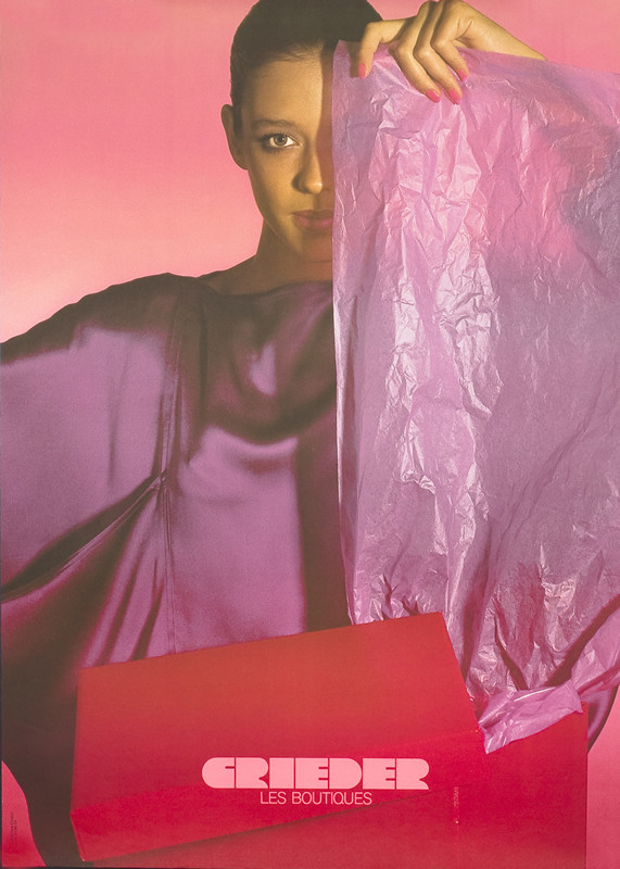 WOMAN UNPACKS BOX; RED, PINK, PURPLE