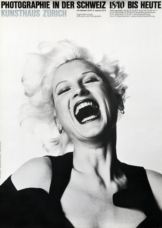 Laughing blonde with big mouth; black, white