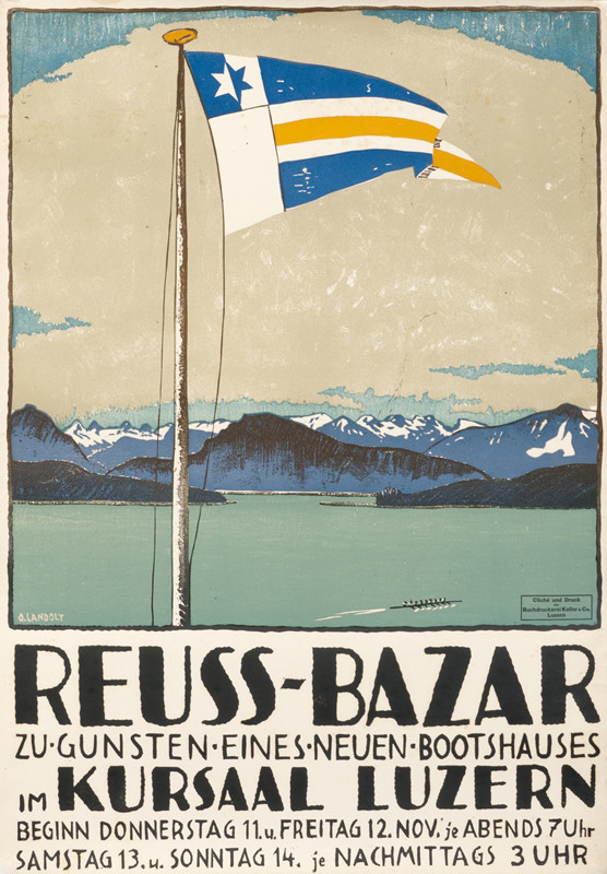Flag waving over lake, mountains in distance; beige, green, blue