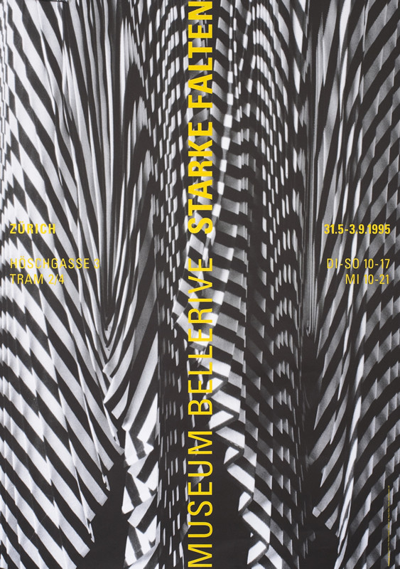 Black and white geometric folded patterns; black, white, yellow