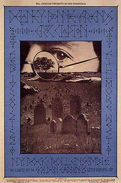 No. 218, image of eye, graveyard, kayakers, Eric Clapton, New York Rock & Roll Ensemble, Golden Earring; blue, yellow
