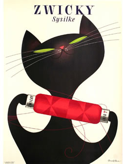 Cat plays with spool of yarn