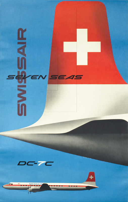 Close up of DC-7C's tail facing right, plane in profile facing left below; blue, red, black, white