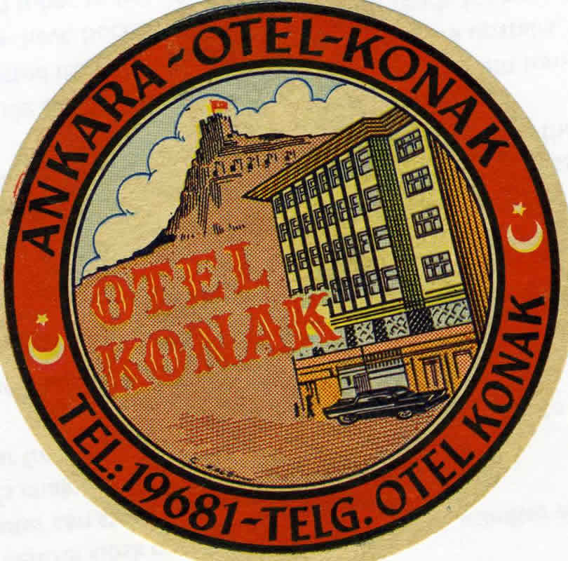 image of hotel in forefront, fortress in back with turkish flag on top; red, orange, yellow, blue
