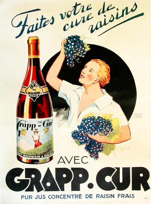 woman holds grape vines next to bottle; blue, orange, black, red
