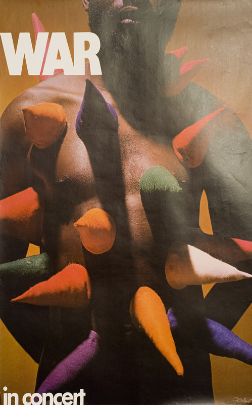 Man's torso with cones protruding from it; brown, red, green, blue, orange