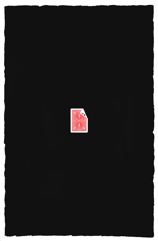 Back of ace of spades playing card with one corner showing "A" to the front; black, white, red