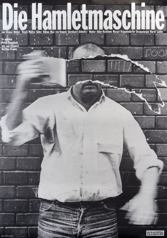 Man in front of brick wall; black, white